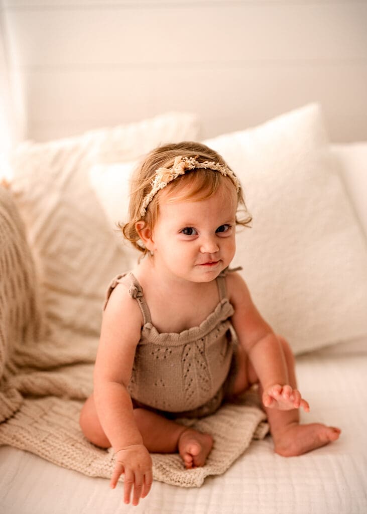 lifestyle portion of a baby girl's first birthday session Clarksville TN
