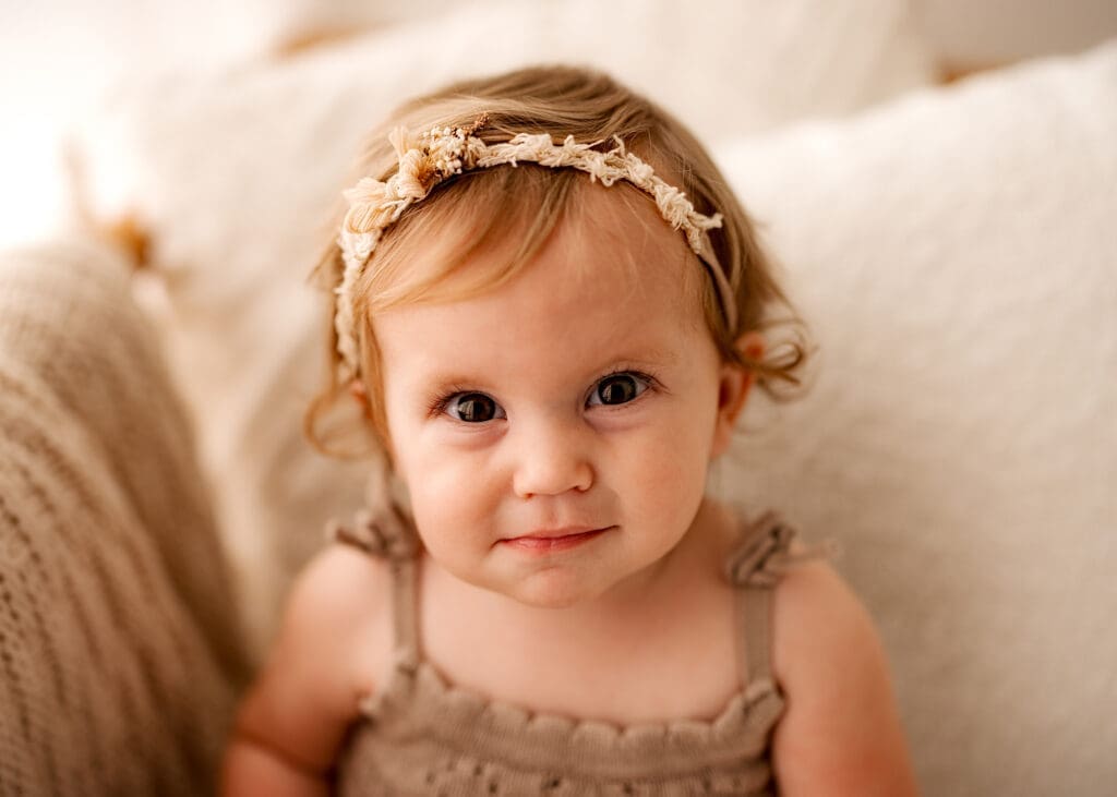 sweet image capturing the personality of a one-year-old during her car smash birthday session 