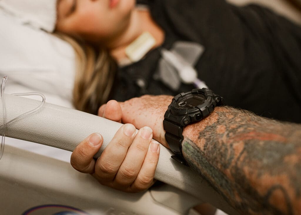 birth photographer captures intimate moment between mother and partner during clients labor