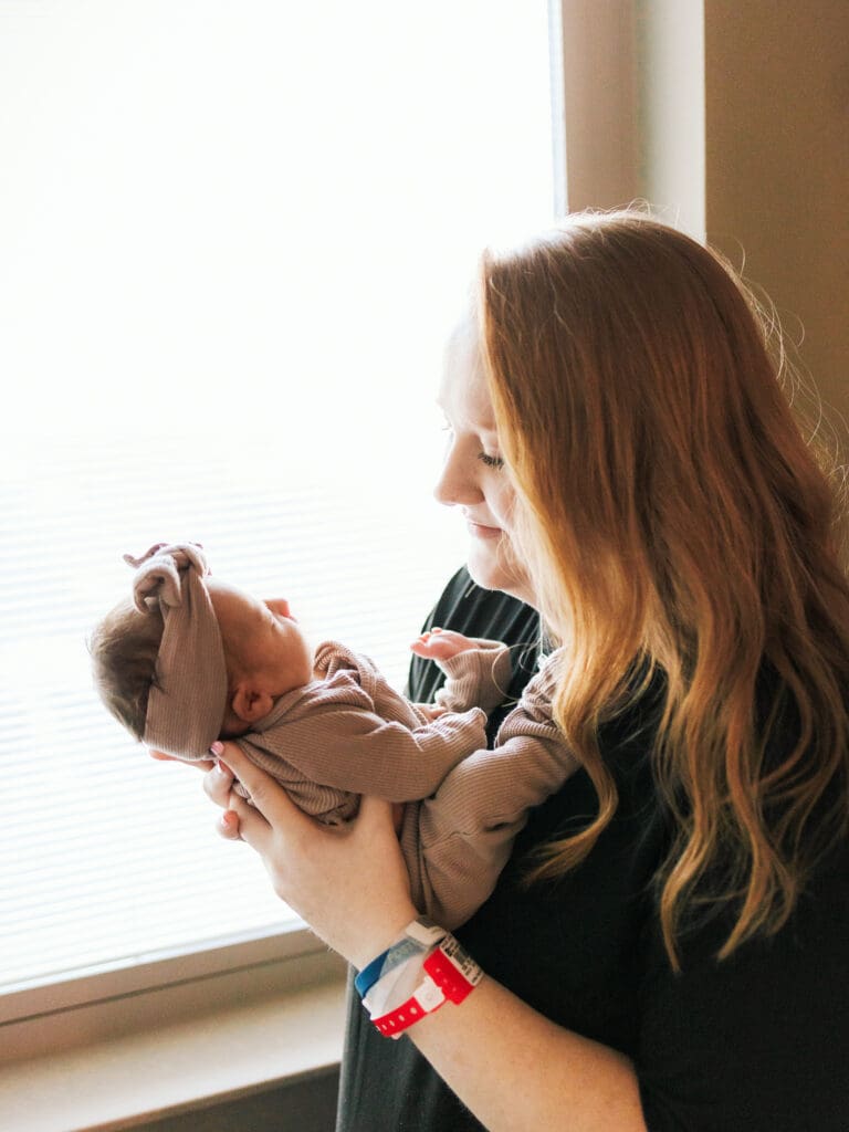 a mother holding her newborn baby during a fresh 48 session in Clarksville TN