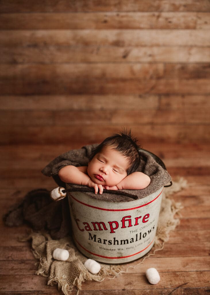 newborn baby boy posed for his newborn photo session