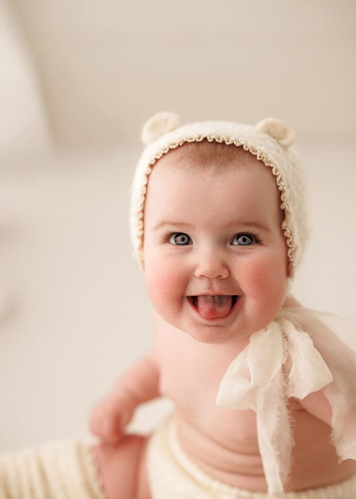 baby milestone photography session with happy baby 
