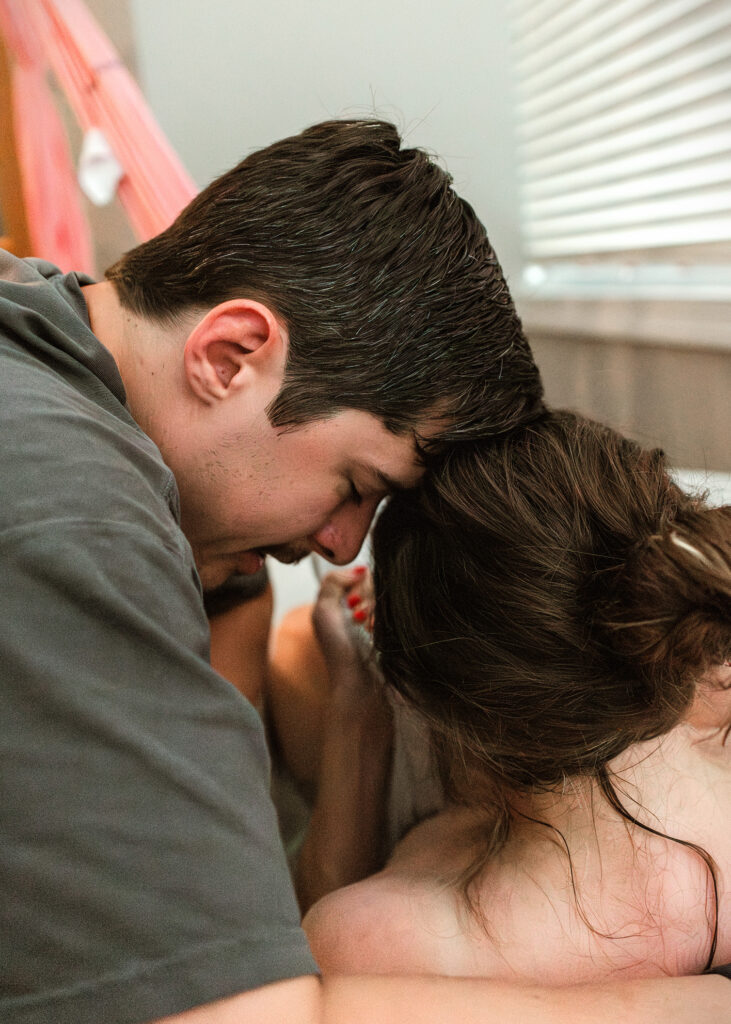 dad supporting mom during labor
